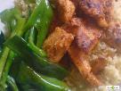 Peri peri chicken served with sauteed green bell pepper strips and cous-cous
